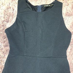 Navy blue dress with a V-cut across the front